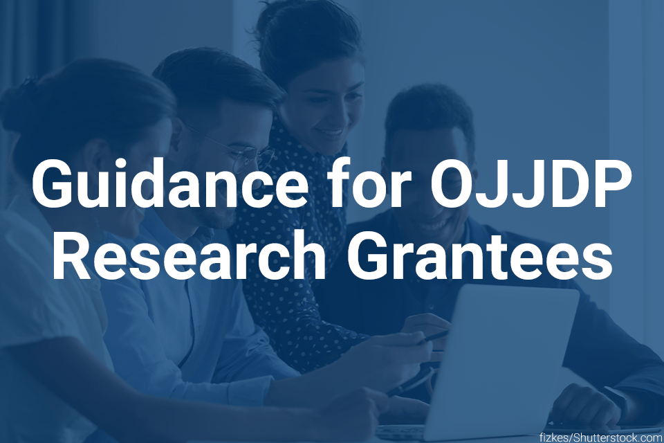 Guidance for OJJDP Research Grantees card Diverse group of people around a computer smiling